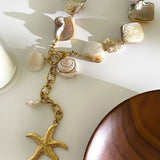 Colar elegante com pendente estrela-do-mar em pérolas